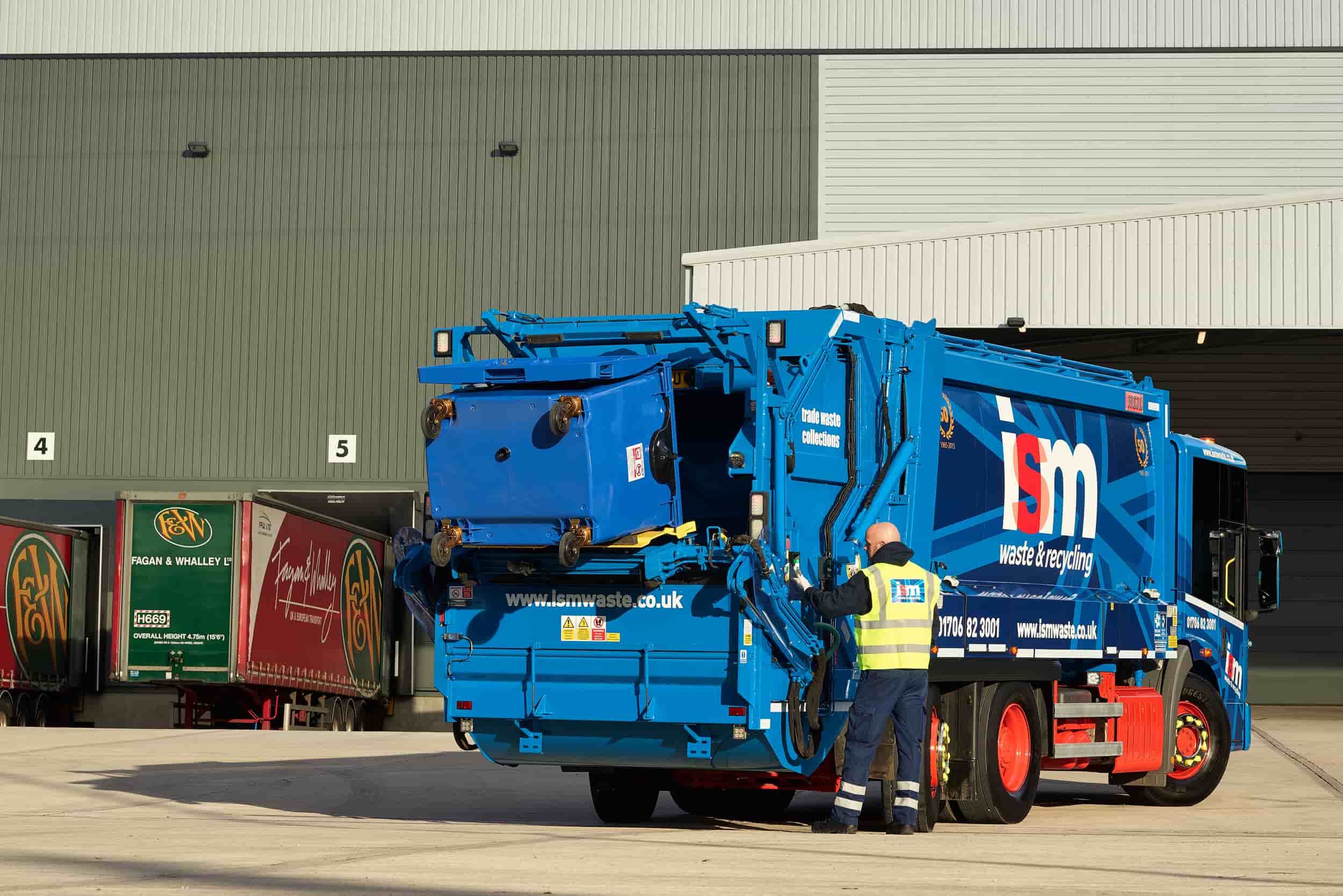 Tipping waste into trade waste truck at a customers site