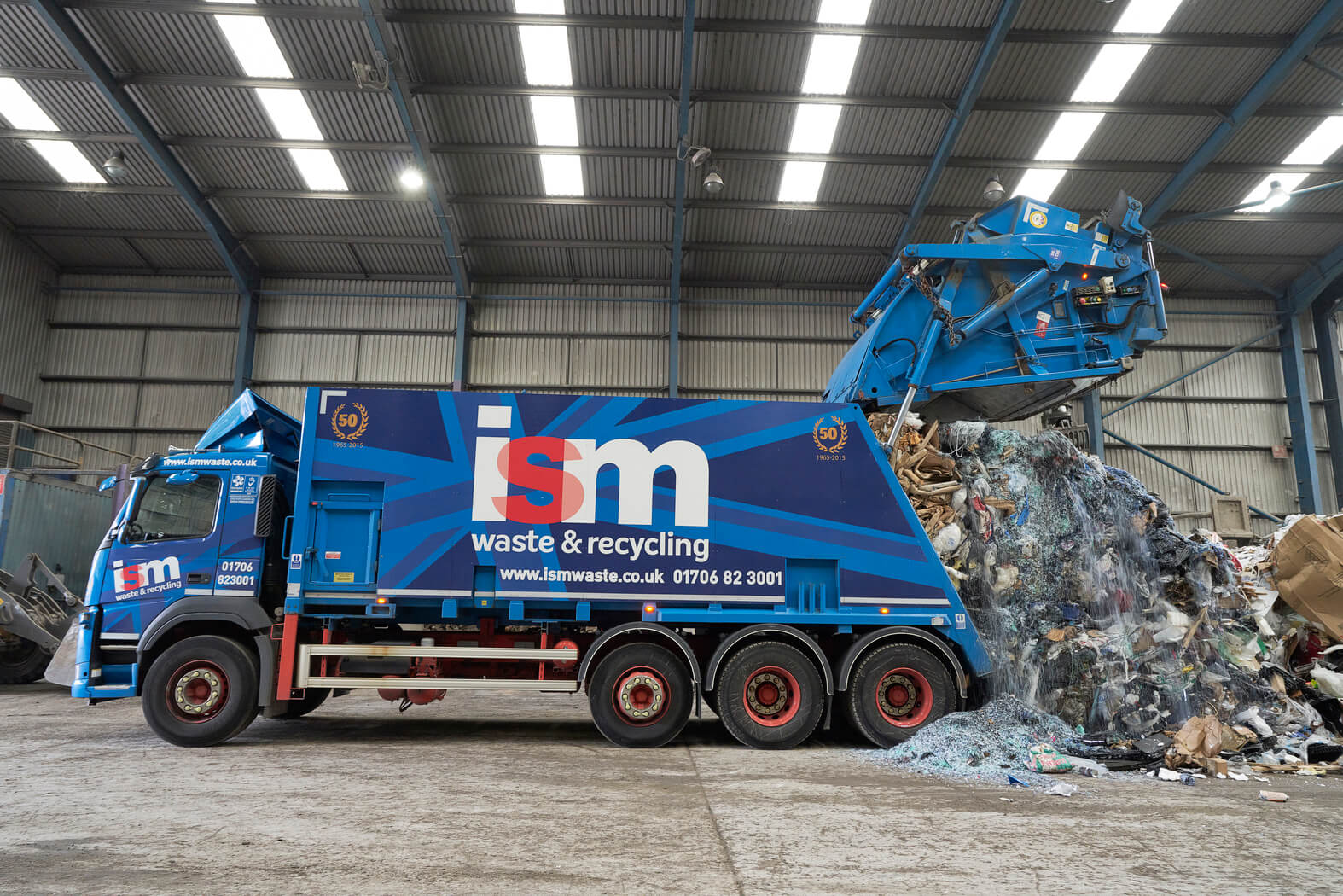 Tipping waste collected from customers in the recycling facility