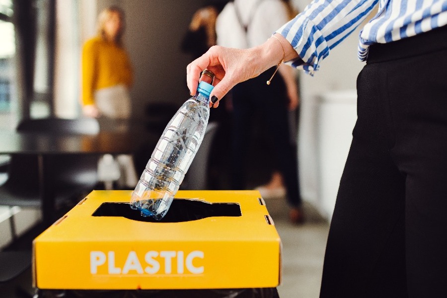 Plastic recycling bin in an office