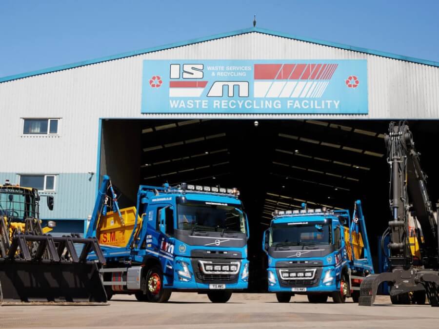 ISM trucks in front of waste transfer station