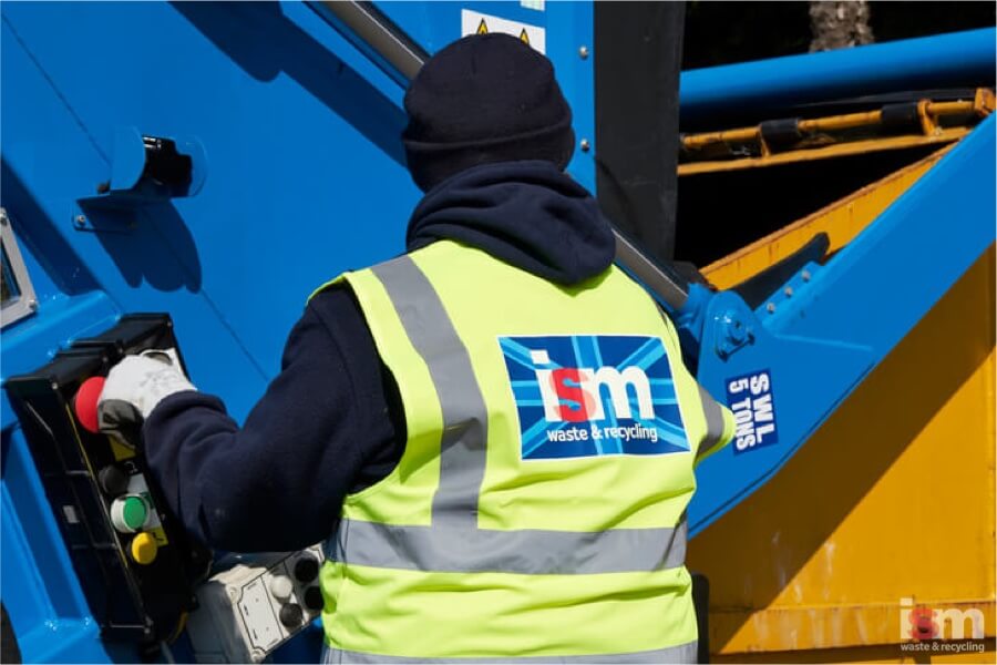 ISM staff collecting waste