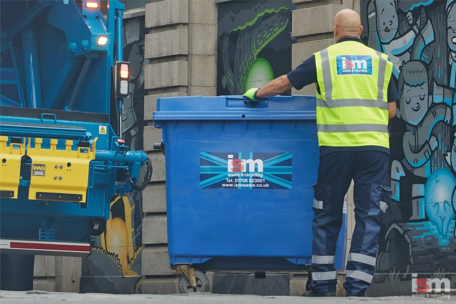 ISM truck driver collecting general waste wheelie bin