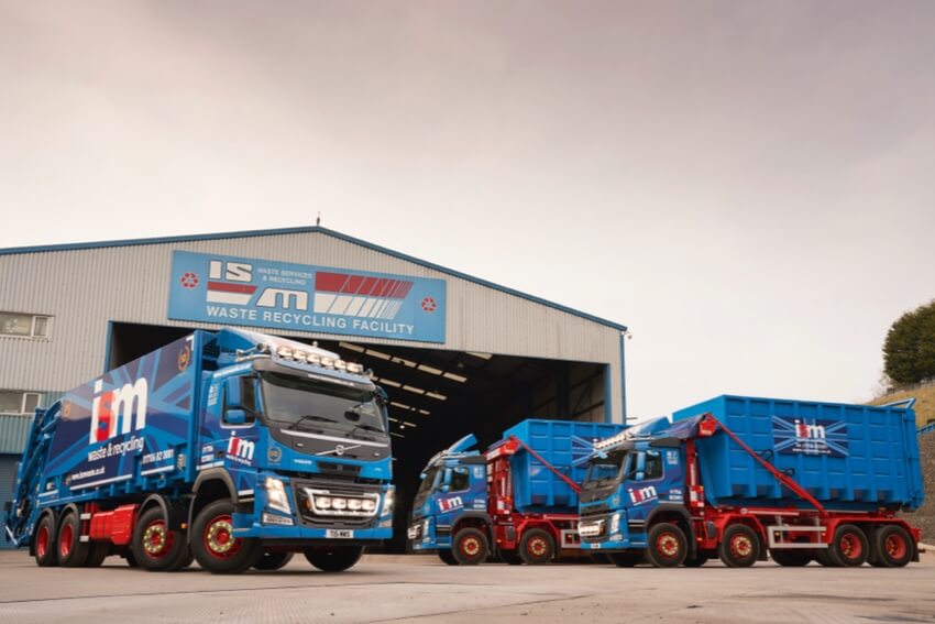 Waste collection vehicles outside ISM recycling facility
