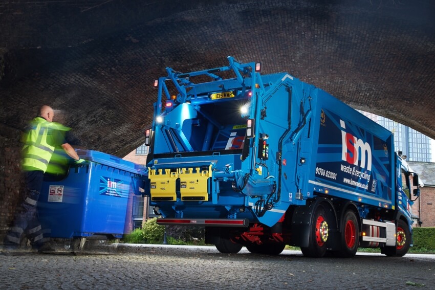 Waste operative collecting a wheelie bin