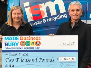 Made in bury winner with big cheque in front of ISM truck