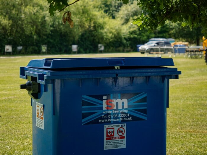 ISM 1100 litre wheelie bin in field for outdoor event
