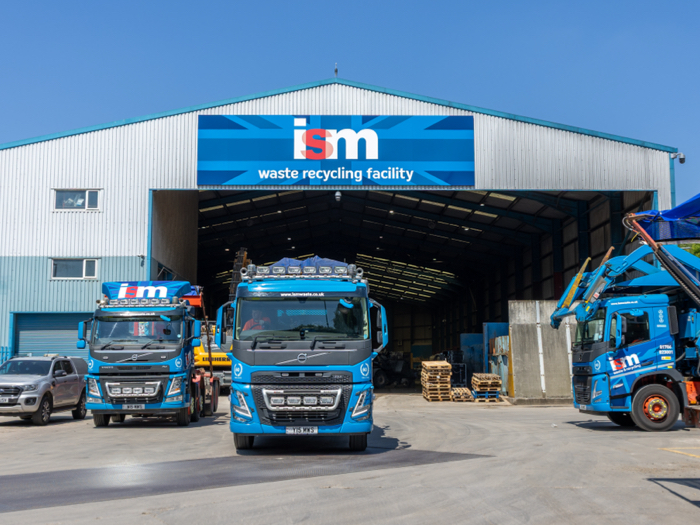 ISM trucks at the front of the recycling facility