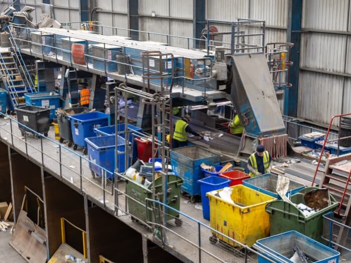 ISM operatives working on the recycling picking line