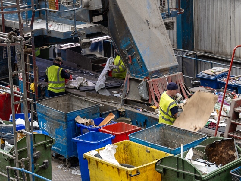 ISM operatives working on recycling picking line